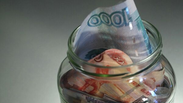 Ruble and euro banknotes of different denominations in a jar. - Sputnik International