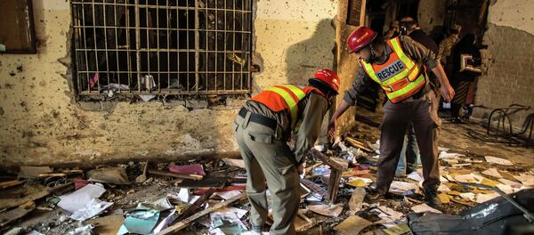 Rescue team members go through debris inside the Army Public School, which was attacked by Taliban gunmen, in Peshawar, December 17, 2014. Rescue team members go through debris inside the Army Public School, which was attacked by Taliban gunmen, in Peshawar, December 17, 2014. - Sputnik International