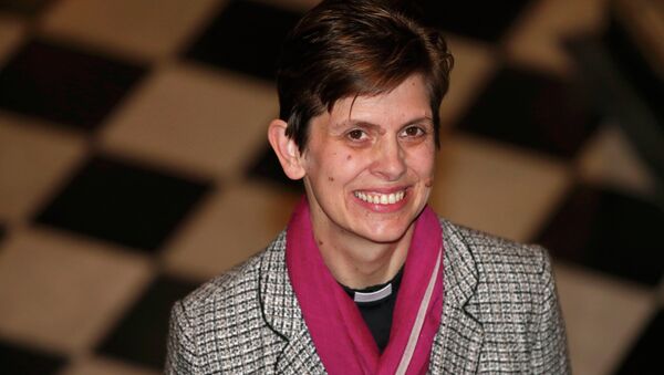 Libby Lane, a suffragan (Assistant) bishop in the Diocese of Chester, poses for photographers after her forthcoming appointment as the new Bishop of Stockport was announced in the Town Hall in Stockport, northern England - Sputnik International