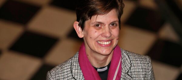 Libby Lane, a suffragan (Assistant) bishop in the Diocese of Chester, poses for photographers after her forthcoming appointment as the new Bishop of Stockport was announced in the Town Hall in Stockport, northern England - Sputnik International