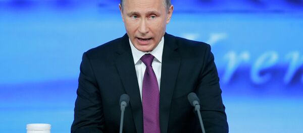 Russian President Vladimir Putin said current downturn in Russian economy was provoked by external factors. - Sputnik International