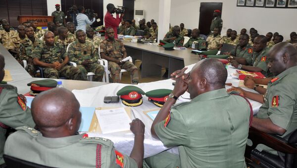 In this Wednesday, Oct. 15, 2014 file photo, soldiers accused of refusing to fight in the country's northeastern Islamic uprising appear before a court martial in Abuja, Nigeria. On Wednesday Dec. 17, 2014, the court-martial sentenced 54 soldiers to death for mutiny, assault, cowardice and refusing to fight Islamic extremists - Sputnik International