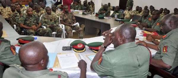 In this Wednesday, Oct. 15, 2014 file photo, soldiers accused of refusing to fight in the country's northeastern Islamic uprising appear before a court martial in Abuja, Nigeria. On Wednesday Dec. 17, 2014, the court-martial sentenced 54 soldiers to death for mutiny, assault, cowardice and refusing to fight Islamic extremists - Sputnik International