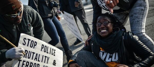 Demonstrators argue with US Capitol police as they march to join a protest against police violence organized by the National Action Network in Washington December 13, 2014. Demonstrators argue with US Capitol police as they march to join a protest against police violence organized by the National Action Network in Washington December 13, 2014. - Sputnik International