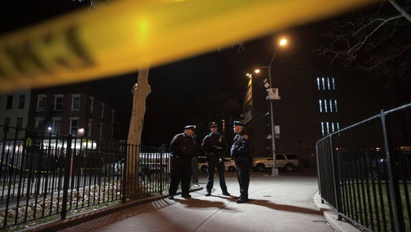 Police are pictured at the scene of a shooting where two New York Police officers were shot dead in the Brooklyn borough of New York, December 20, 2014 - Sputnik International