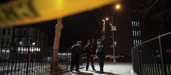Police are pictured at the scene of a shooting where two New York Police officers were shot dead in the Brooklyn borough of New York, December 20, 2014 Police are pictured at the scene of a shooting where two New York Police officers were shot dead in the Brooklyn borough of New York, December 20, 2014 - Sputnik International