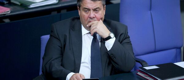 Germany's Economy Minister Sigmar Gabriel holds a MOBILE phone during a debate at the lower house of parliament Bundestag in Berlin, November 26, 2014 Germany's Economy Minister Sigmar Gabriel holds a MOBILE phone during a debate at the lower house of parliament Bundestag in Berlin, November 26, 2014 - Sputnik International