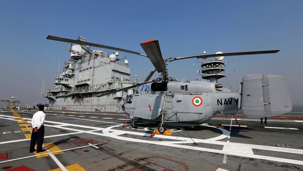 A Kamov 31 helicopter is parked on the deck of INS Vikramaditya, Indian Navy's aircraft carrier, is seen anchored in the Arabian sea off the coast of Mumbai December 3, 2014 - Sputnik International