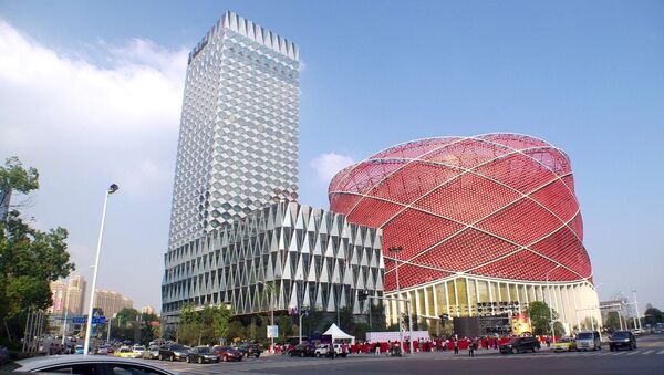 The Chinese lantern-shaped Han Show Theater, right, alongside the Wanda Reign Hotel in Wuhan, China - Sputnik International