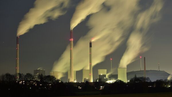 In this Monday, Nov. 24, 2014 file photo, smoke streams from the chimneys of the E.ON coal-fired power station in Gelsenkirchen, Germany - Sputnik International