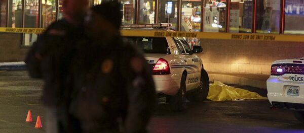 Police stand guard Wednesday, Dec. 24, 2014, following a shooting Tuesday at a gas station in Berkeley, Mo. Police stand guard Wednesday, Dec. 24, 2014, following a shooting Tuesday at a gas station in Berkeley, Mo. - Sputnik International