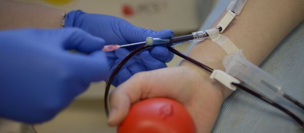 A donor gives blood at the Blood Center A donor gives blood at the Blood Center - Sputnik International