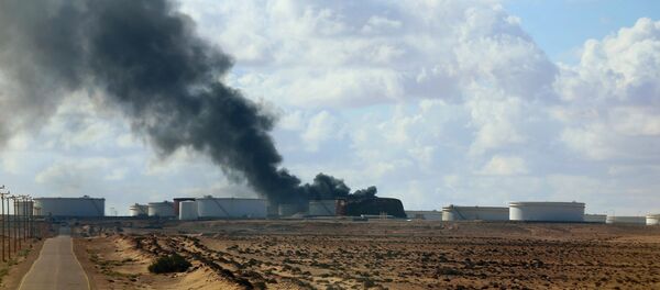 A violent skirmish between Libyan soldiers and Islamist militants on Thursday, December 25, in eastern Libya claimed the lives of 19, while an oil tanker was damaged by a rocket at the port of Al-Sidra during a separate clash - Sputnik International