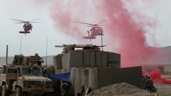 Black Hawk Helicopters coming in to land at firebase in Afghanistan - Sputnik International