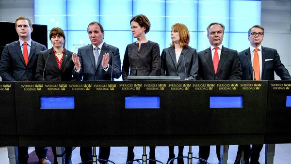 Prime Minister Stefan Lofven gestures next to  leaders of Swedish political parties during a news conference at the Swedish Parliament in Stockholm - Sputnik International
