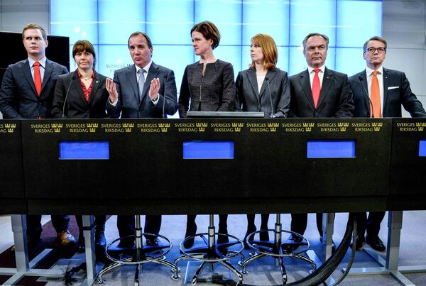 Prime Minister Stefan Lofven gestures next to leaders of Swedish political parties during a news conference at the Swedish Parliament in Stockholm Prime Minister Stefan Lofven gestures next to leaders of Swedish political parties during a news conference at the Swedish Parliament in Stockholm - Sputnik International