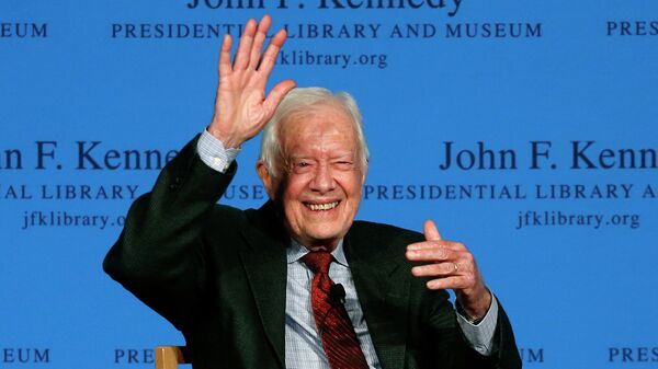 Former President Jimmy Carter waves to a member of the audience after a forum at the John F. Kennedy Presidential Library and Museum in Boston - Sputnik International