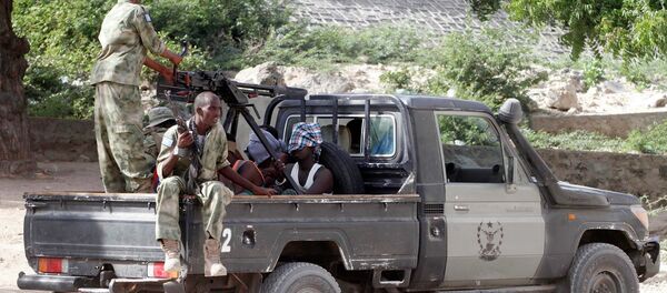 Somalia security forces transport blind-folded suspects detained on their pick-up truck after attackers from the militant group al Shabaab invaded the African Union's Halane base on the edge of the Mogadishu international airport compound in Somalia's capital Mogadishu Somalia security forces transport blind-folded suspects detained on their pick-up truck after attackers from the militant group al Shabaab invaded the African Union's Halane base on the edge of the Mogadishu international airport compound in Somalia's capital Mogadishu - Sputnik International