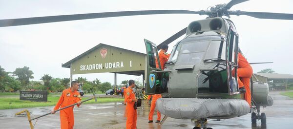 A search and rescue squad from the Indonesian Airforce prepare to depart on a Puma helicopter to take part in the search for the missing AirAsia Flight QZ8501, from a base in Kubu Raya, West Kalimantan A search and rescue squad from the Indonesian Airforce prepare to depart on a Puma helicopter to take part in the search for the missing AirAsia Flight QZ8501, from a base in Kubu Raya, West Kalimantan - Sputnik International