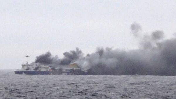 Smoke rises from the Italian-flagged Norman Atlantic after it caught fire in the Adriatic Sea. - Sputnik International