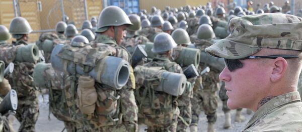 US Army Cpl. William Metz, a Clearwater, Fla., native, now a team leader and adviser with 3rd Battalion, 4th Infantry Regiment, 170th Infantry Brigade Combat Team, watches as Afghan National Army recruits finish a march at the Kabul Military Training Center US Army Cpl. William Metz, a Clearwater, Fla., native, now a team leader and adviser with 3rd Battalion, 4th Infantry Regiment, 170th Infantry Brigade Combat Team, watches as Afghan National Army recruits finish a march at the Kabul Military Training Center - Sputnik International