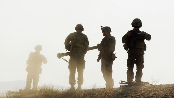U.S. soldiers from D Troop of the 3rd Cavalry Regiment walk on a hill after finishing with a training exercise near forward operating base Gamberi in the Laghman province of Afghanistan December 30, 2014 - Sputnik International