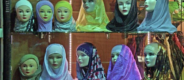 The proposed provisions would impose a strict dress code for TV hosts and anchors, including an abaya and scarf for women, the media outlet underscores. The proposed provisions would impose a strict dress code for TV hosts and anchors, including an abaya and scarf for women, the media outlet underscores. - Sputnik International