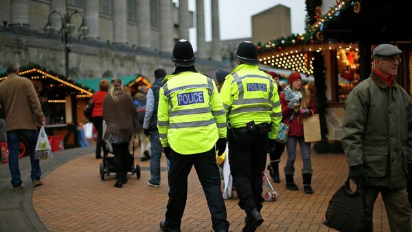 West Midlands Police officers patrol the German Christmas Market in Birmingham, central England, December 9, 2014 - Sputnik International