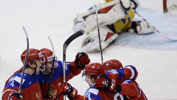 Russian players celebrate their victory in the Ice Hockey World Junior Championships semifinal between the national teams of Sweden and Russia in Toronto, Canada - Sputnik International