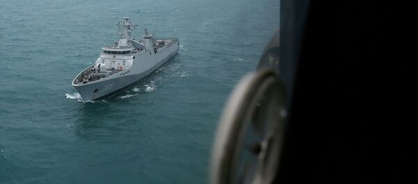 Indonesian navy ship KRI Sultan Hasanudin is seen through the window of a Super Puma helicopter during a search operation for passengers onboard AirAsia Flight QZ8501, off the Java sea, in Indonesia January 7, 2015 Indonesian navy ship KRI Sultan Hasanudin is seen through the window of a Super Puma helicopter during a search operation for passengers onboard AirAsia Flight QZ8501, off the Java sea, in Indonesia January 7, 2015 - Sputnik International
