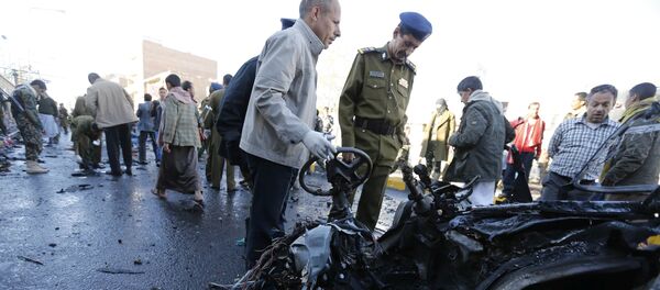 Police investigators look at the wreckage of a car at the scene of a car bomb outside the police college in Sanaa January 7, 2015 Police investigators look at the wreckage of a car at the scene of a car bomb outside the police college in Sanaa January 7, 2015 - Sputnik International