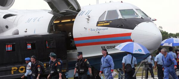 Russian rescuers unload gears from their Beriev Be-200 amphibious aircraft Russian rescuers unload gears from their Beriev Be-200 amphibious aircraft - Sputnik International