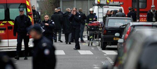 Police officers and firemen gather outside the French satirical newspaper Charlie Hebdo's office, in Paris, Wednesday, Jan. 7, 2015 Police officers and firemen gather outside the French satirical newspaper Charlie Hebdo's office, in Paris, Wednesday, Jan. 7, 2015 - Sputnik International