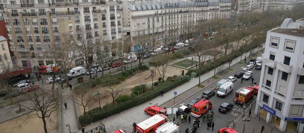 Police and rescue forces are seen near the scene after a shooting at the Paris offices of Charlie Hebdo, a satirical newspaper, January 7, 2015 Police and rescue forces are seen near the scene after a shooting at the Paris offices of Charlie Hebdo, a satirical newspaper, January 7, 2015 - Sputnik International