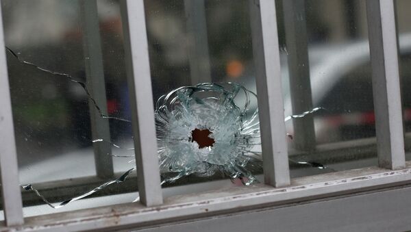 A bullet impact is seen in a window - Sputnik International