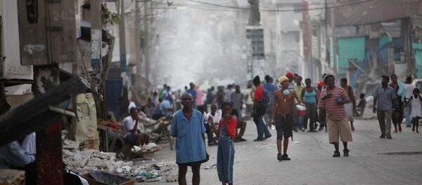 Displaced Haitians whose homes were damage during the earthquake gather in a street of Port-au-Prince, Friday, Jan. 15, 2010. Displaced Haitians whose homes were damage during the earthquake gather in a street of Port-au-Prince, Friday, Jan. 15, 2010. - Sputnik International