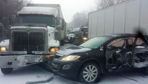 Bauer Truck Repair, vehicles remain at the scene of a fatal 18-vehicle pileup that occurred in whiteout conditions Wednesday, Jan. 7, 2015 - Sputnik International
