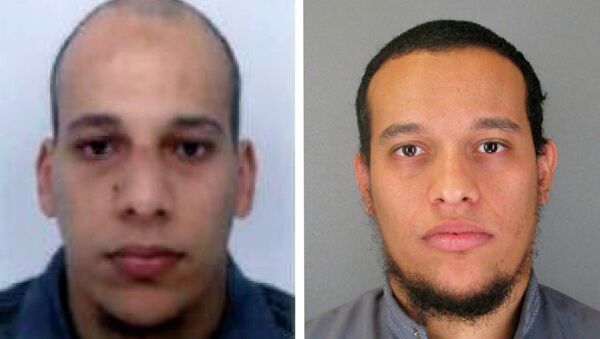 This photo provided by The Paris Police Prefecture Thursday, Jan.8, 2015 shows the suspects Cherif, left, and Said Kouachi in the newspaper attack along with a plea for witnesses - Sputnik International