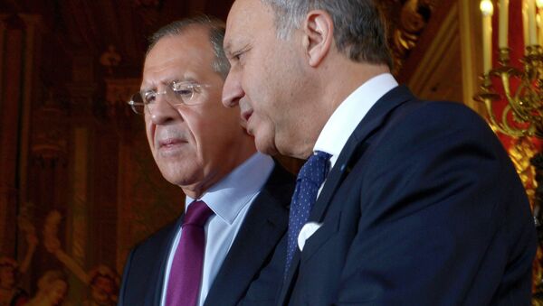 Russian Foreign Minister Sergei Lavrov, left, meets with his French counterpart Laurent Fabius - Sputnik International