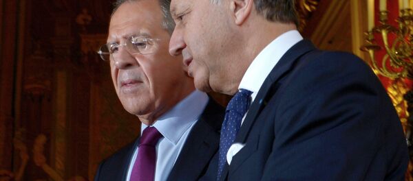 Russian Foreign Minister Sergei Lavrov, left, meets with his French counterpart Laurent Fabius - Sputnik International