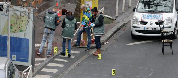 Police forensics experts examine the scene where a female police officer was shot dead in Montrouge, a southern suburb of Paris on January 8, 2015 Police forensics experts examine the scene where a female police officer was shot dead in Montrouge, a southern suburb of Paris on January 8, 2015 - Sputnik International