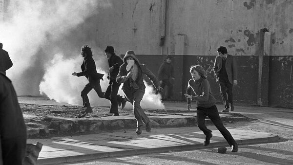 Young Catholic rioters hurl projectiles 02 March 1972 in Londonderry at British soldiers during a rally protesting the 30 January Bloody Sunday killing by British paratroopers of 13 Catholics civil rights marchers in Londonderry. - Sputnik International
