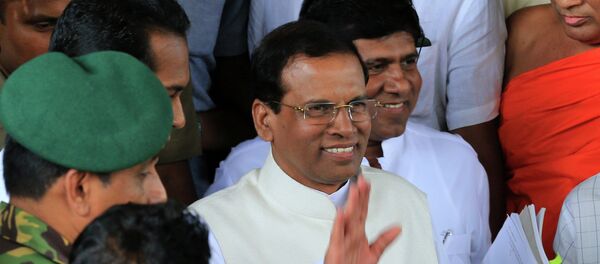 Sri Lanka's newly elected President Maithripala Sirisena waves as he leaves the Department of Election office on January 9, 2015. - Sputnik International
