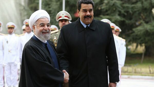 In this photo released by the official website of the office of the Iranian Presidency, Venezuelan President Nicolas Maduro, right, shakes hands with his Iranian counterpart Hassan Rouhani during his official welcoming ceremony at the Saadabad Palace in Tehran, Iran, Saturday, Jan. 10, 2015. - Sputnik International