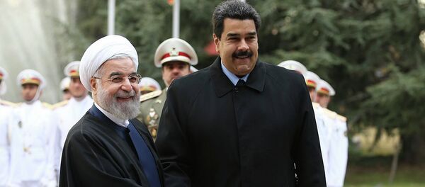 In this photo released by the official website of the office of the Iranian Presidency, Venezuelan President Nicolas Maduro, right, shakes hands with his Iranian counterpart Hassan Rouhani during his official welcoming ceremony at the Saadabad Palace in Tehran, Iran, Saturday, Jan. 10, 2015. In this photo released by the official website of the office of the Iranian Presidency, Venezuelan President Nicolas Maduro, right, shakes hands with his Iranian counterpart Hassan Rouhani during his official welcoming ceremony at the Saadabad Palace in Tehran, Iran, Saturday, Jan. 10, 2015. - Sputnik International