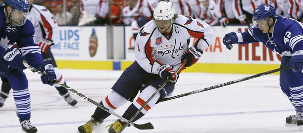 Washington Capitals forward Alex Ovechkin (8) carries the puck past Toronto Maple Leafs forward James van Riemsdyk (left) and forward Tyler Bozak (right) during the first period at the Air Canada Centre. Washington Capitals forward Alex Ovechkin (8) carries the puck past Toronto Maple Leafs forward James van Riemsdyk (left) and forward Tyler Bozak (right) during the first period at the Air Canada Centre. - Sputnik International