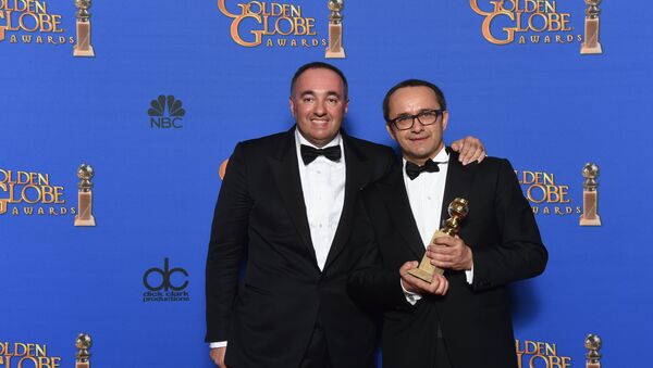 Alexander Rodnyansky and Andrey Zvyagintsev pose with the award for Best Foreign Language Film for Leviathan, in the press room at the 72nd annual Golden Globe Awards - Sputnik International