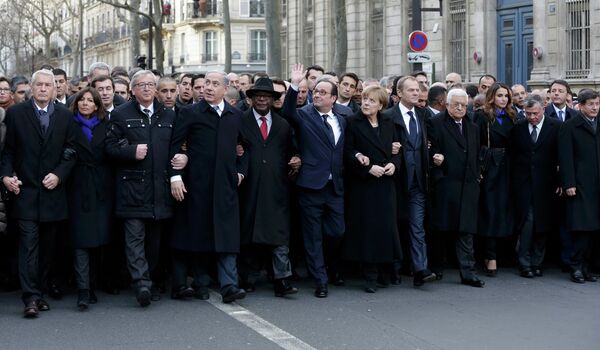 French President Francois Hollande is surrounded by Heads of state as they attend the solidarity march (Marche Republicaine) in the streets of Paris January 11, 2015. French President Francois Hollande is surrounded by Heads of state as they attend the solidarity march (Marche Republicaine) in the streets of Paris January 11, 2015. - Sputnik International