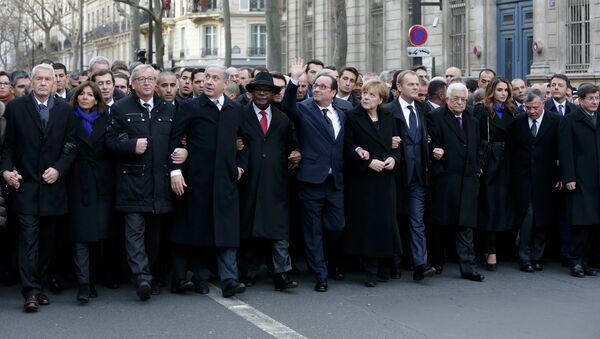 French President Francois Hollande is surrounded by Heads of state as they attend the solidarity march (Marche Republicaine) in the streets of Paris January 11, 2015. - Sputnik International