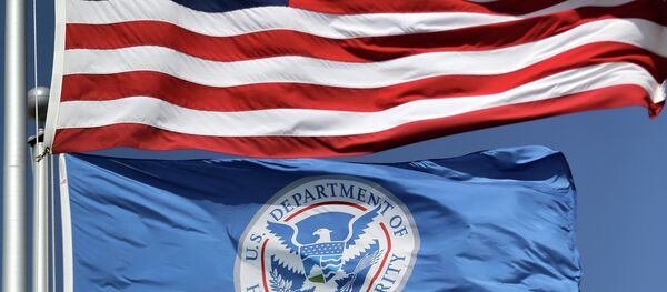 The U.S. and U.S. Department of Homeland Security flags fly over the Karnes County Residential Center in Karnes City, Texas - Sputnik International